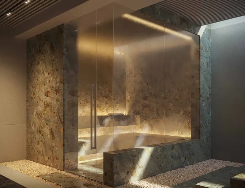 Sauna do spa do Ipanema Almar com revestimento em pedra e iluminação indireta